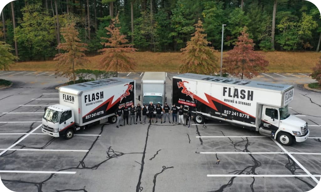 Local Movers in Newton Stay Next to Two Big Trucks