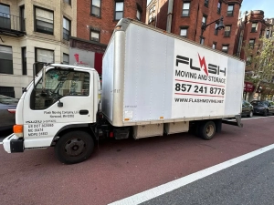 truck of moving company parked on the street of Boston, Flash moving & Storage